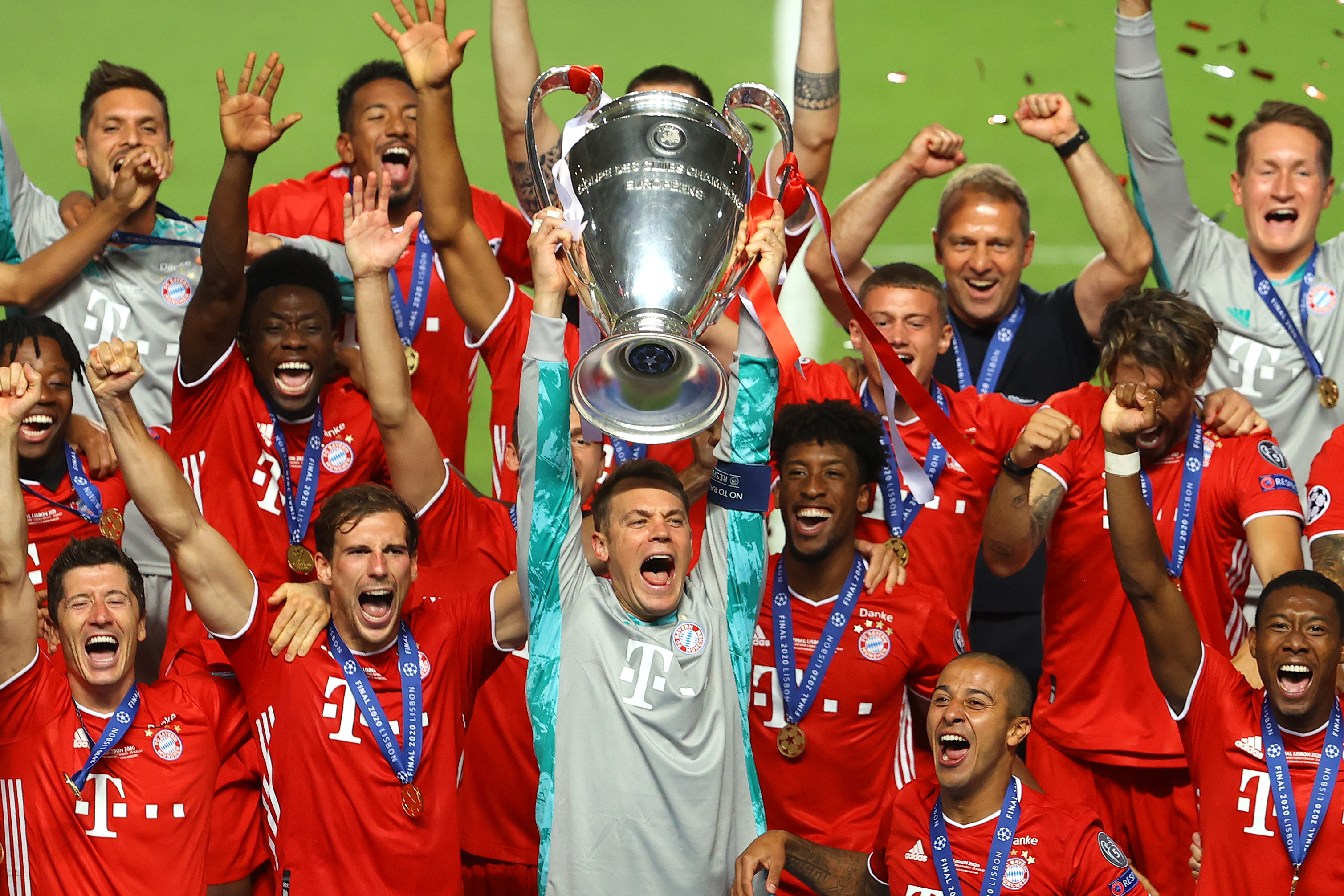 Bayern Munich captain Manuel Neuer lifts the Champions League trophy alongside his team-mates after the Bavarians' win over Paris Saint-Germain in the 2020 final.