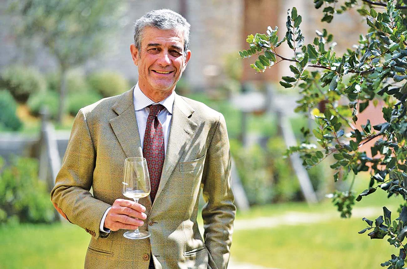 Francesco Mazzei with a glass of Vermentino