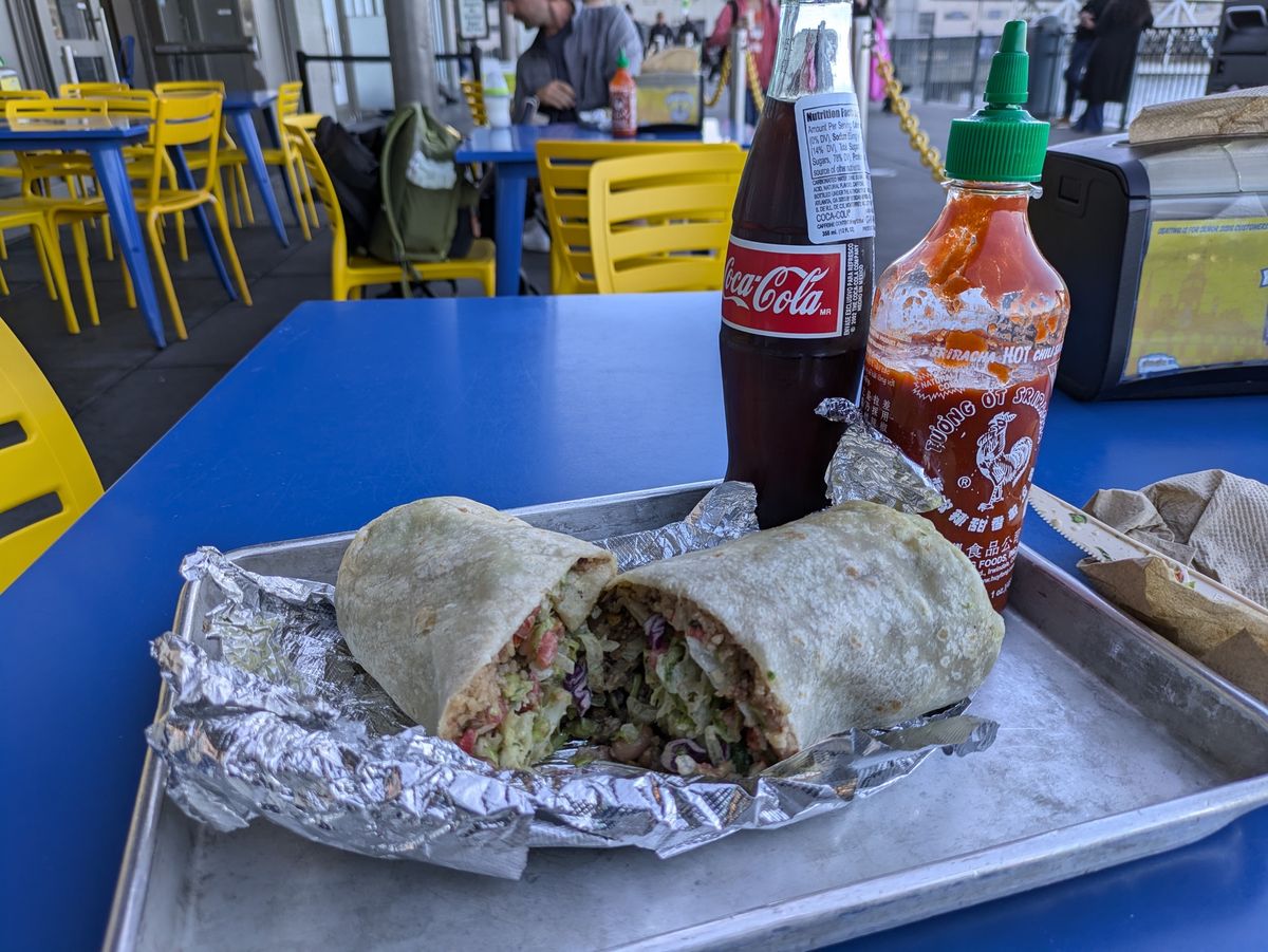 Shot of a burrito with coke and hot sauce shot by a Pixel 8a