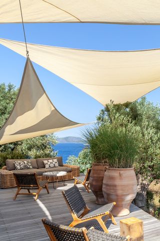 decking area in a Mediterranean style garden over looking the sea