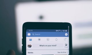 Smartphone screen showing Facebook feed