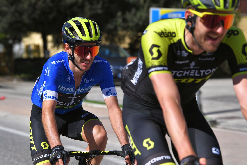 Adam Yates wears the leader's jersey