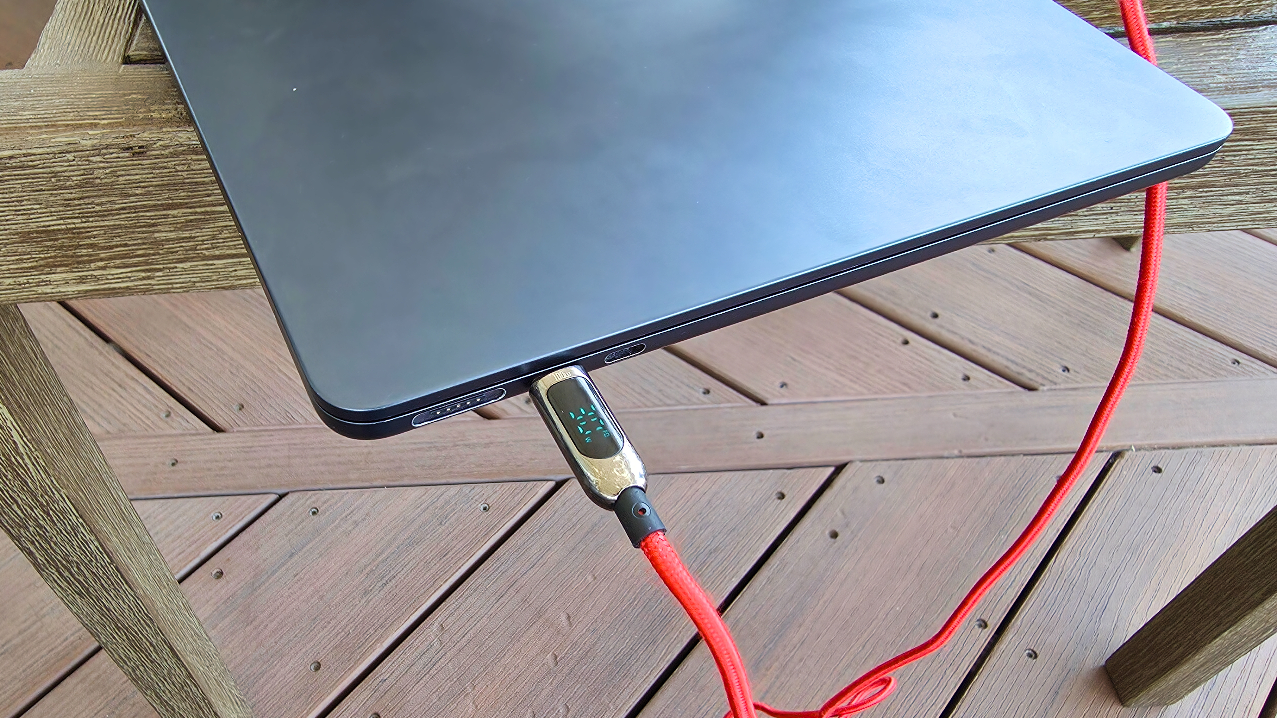 A SooPii USB-C cable connected to a power bank and a MacBook Air.