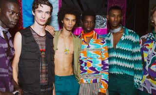 Seventies-inspired menswear looks with knitted shirts and shorts and chevron stripe capes in the brand’s signature Lurex knits