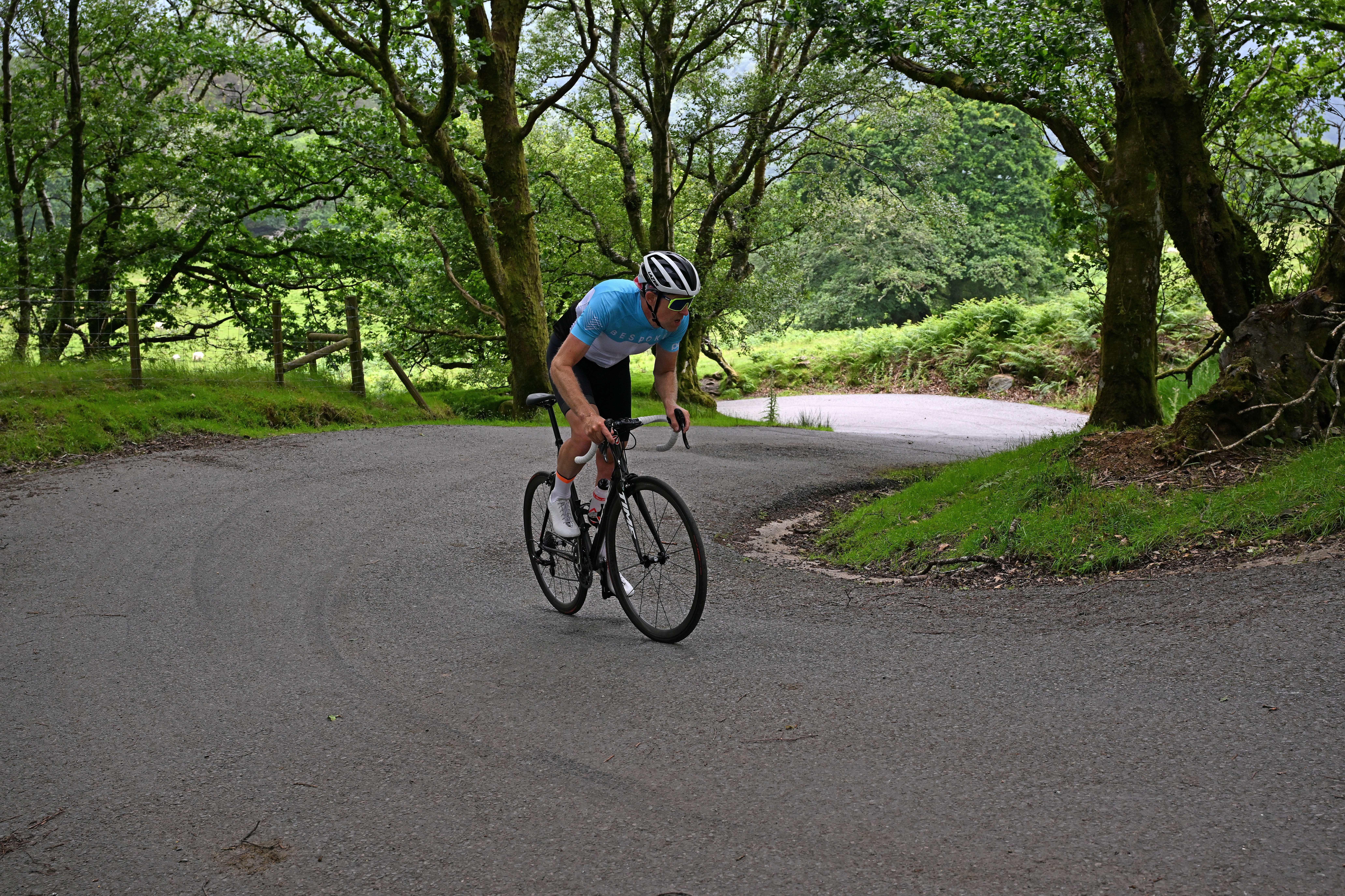 Man cycles up hill