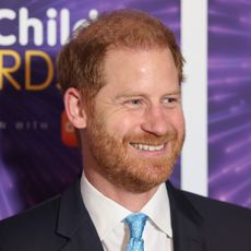 Prince Harry smiles while wearing a suit to attend the Wellchild Awards 2024 at the Royal Lancaster Hotel in London on September 30, 2024