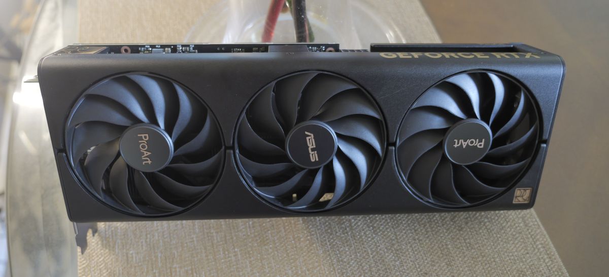 An ASUS ProArt RTX 4060 Ti graphics card sitting on a desk