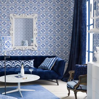 blue sofa against patterned wall