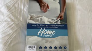 Tempur Cooling Tencel Mattress Protector unboxed on the bed