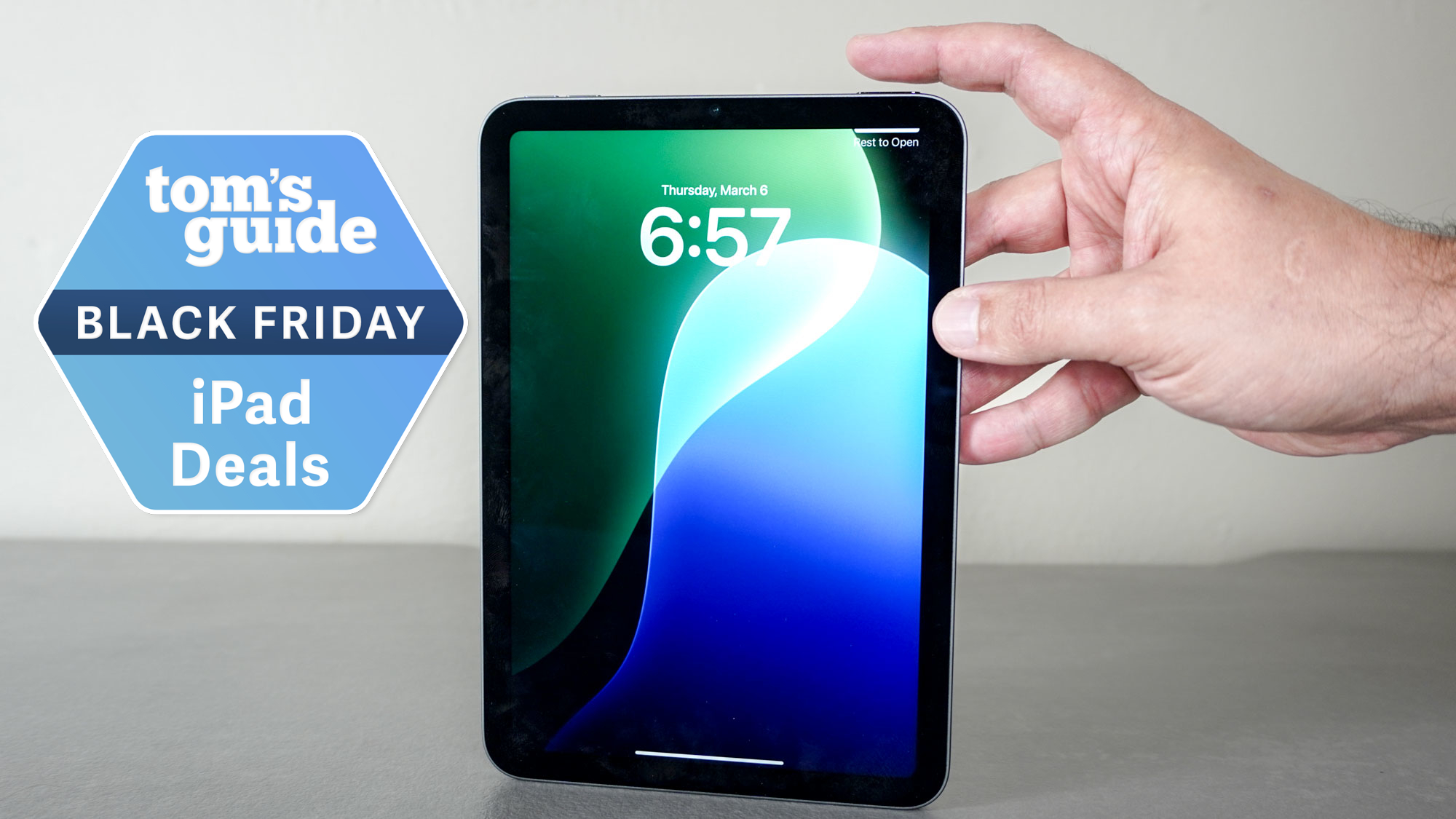 An iPad mini on a table with a Tom's Guide Black Friday deals badge