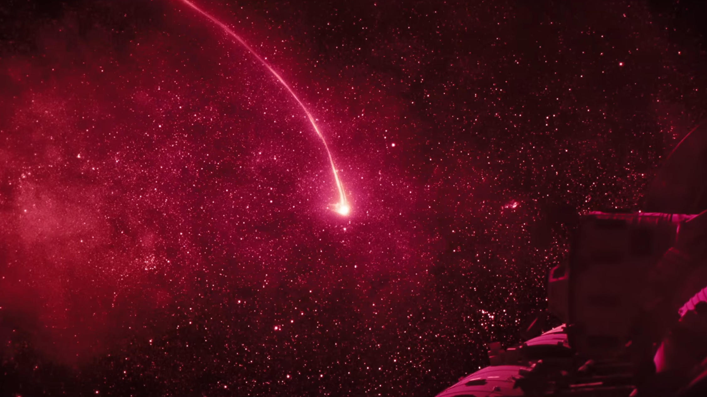 A pink-red line extending from a star in space, shown in the film Project Hail Mary.