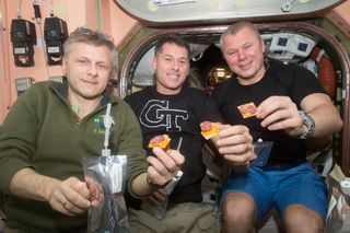 Expedition crewmembers have snacktime