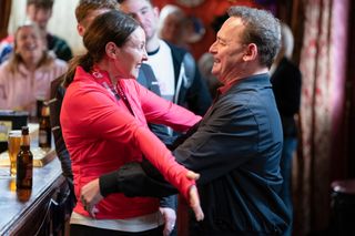 Honey and Billy hug after Jay and Honey complete the London Marathon 2024 in EastEnders 
