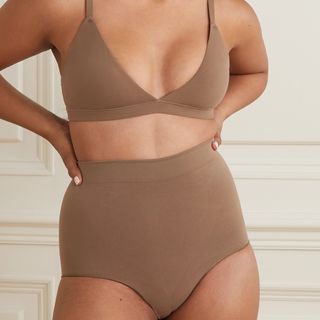 SKIMS Fits Everybody bralette and matching underwear on a woman