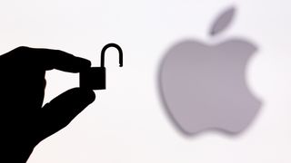 opened padlock in front of Apple logo 