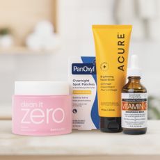 Photo of skincare and supplements from iHerb on a bathroom shelf.