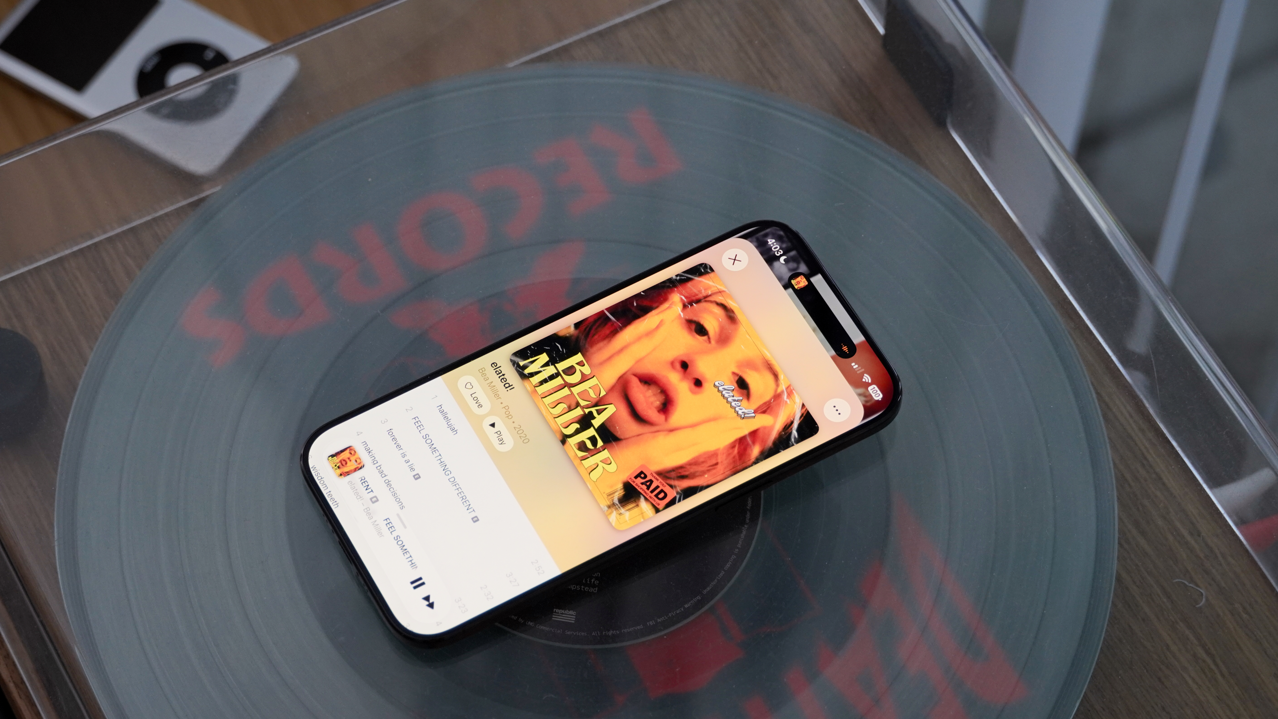 Music player apps running on various Android phones and iPhones.