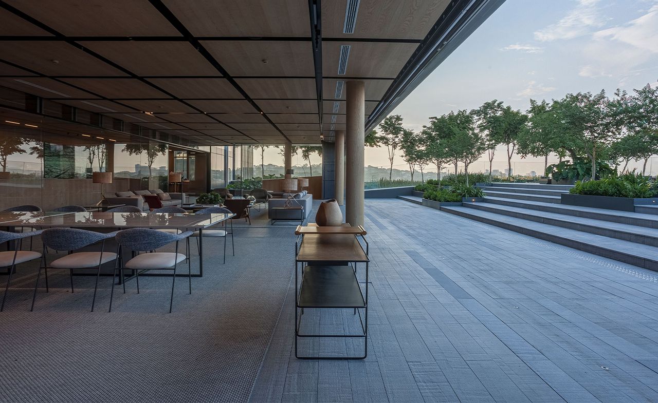 Iguatemi apartment in Sao Paulo with large glass window overlooking the terrace