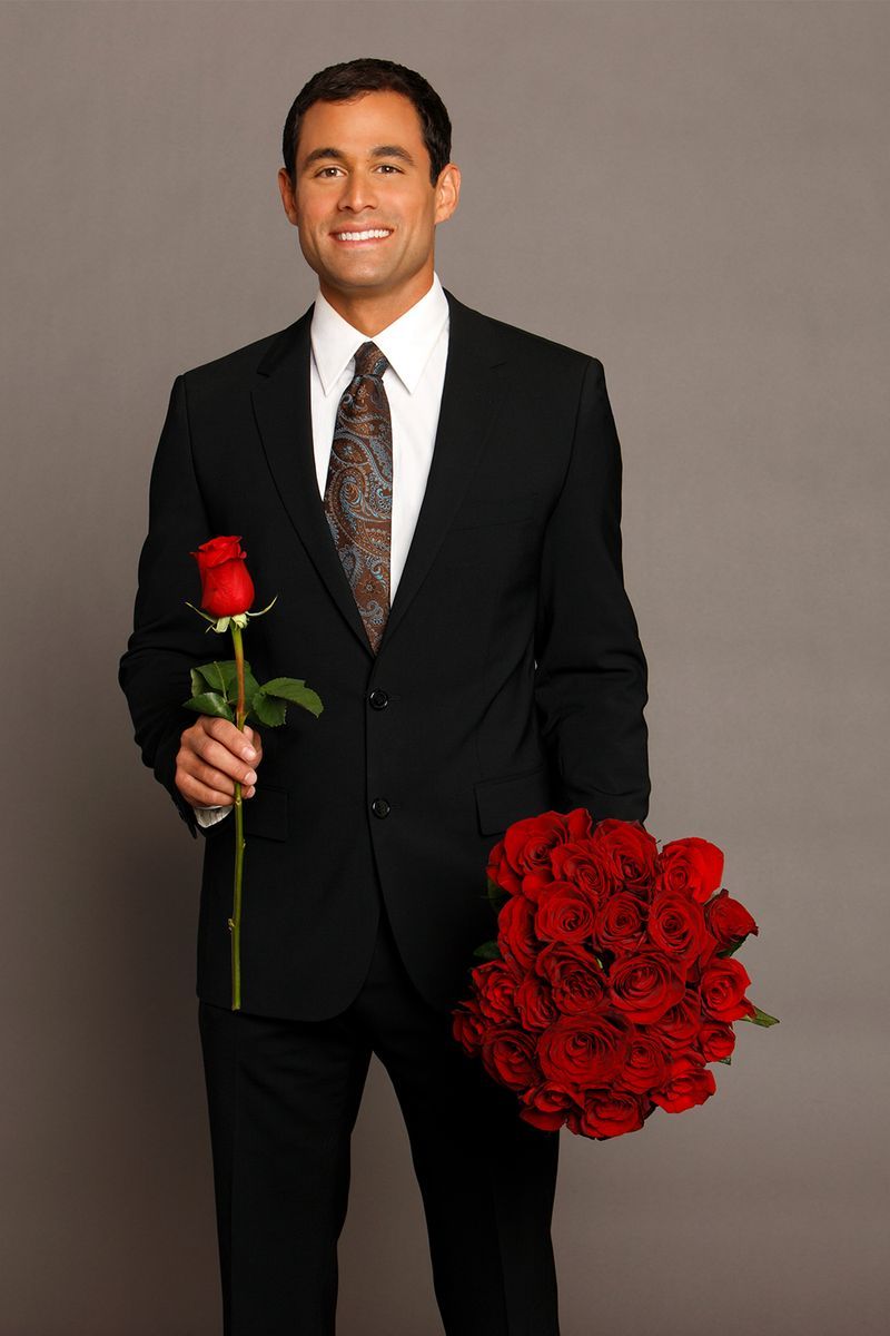 Suit, Formal wear, Red, Tuxedo, Flower, Floristry, Bouquet, Plant, Smile, Flower Arranging,
