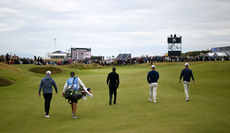 Tiger Woods walks down the fairway at The Open