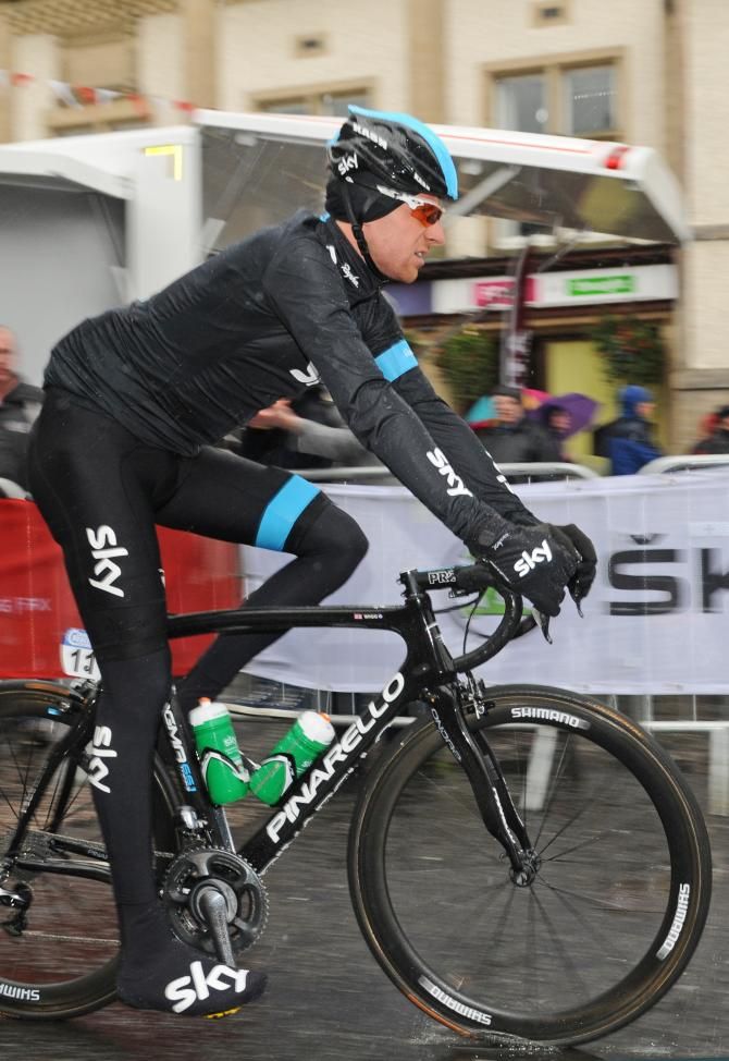 Bradley Wiggins goes to sign in