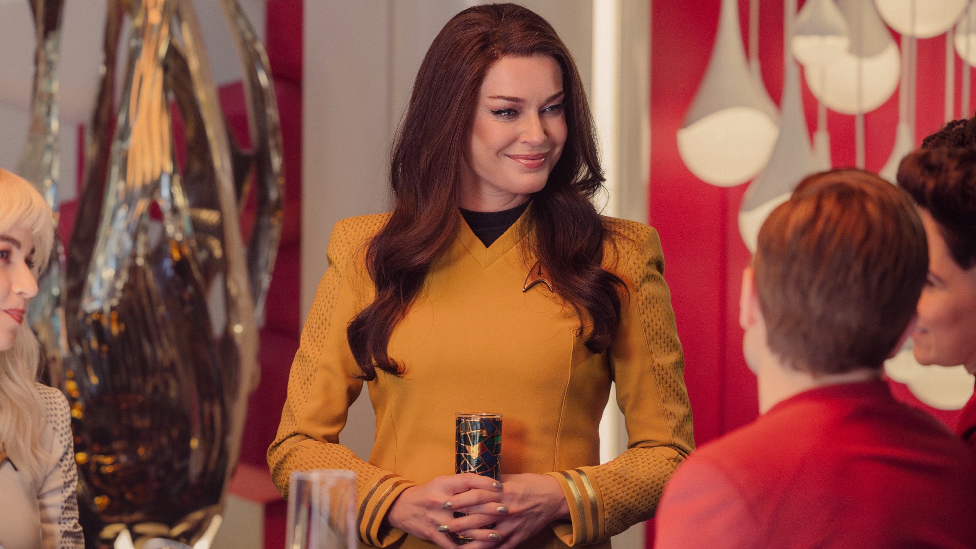 Una smiling and talking to the crew
