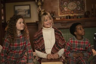 Goldie Hawn smiles in matching pj's with two children in 'The Christmas Chronicles 2'