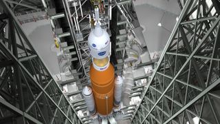 An artist's concept of a NASA Orion spacecraft being attached to its Space Launch System megarocket. 