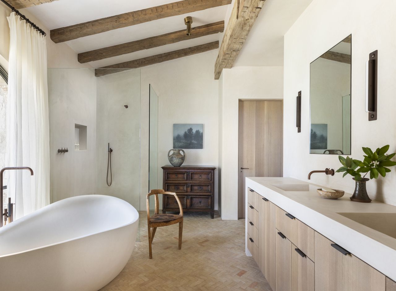 A bathroom with wooden beams