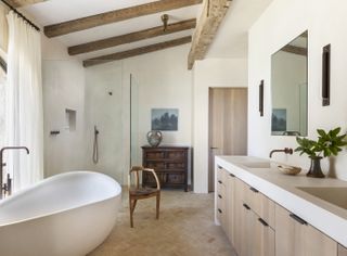 A bathroom with wooden beams