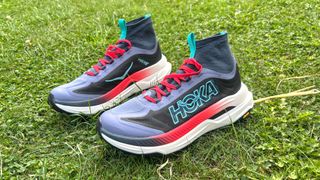 Hoka Tecton X3 trail running shoes on grass