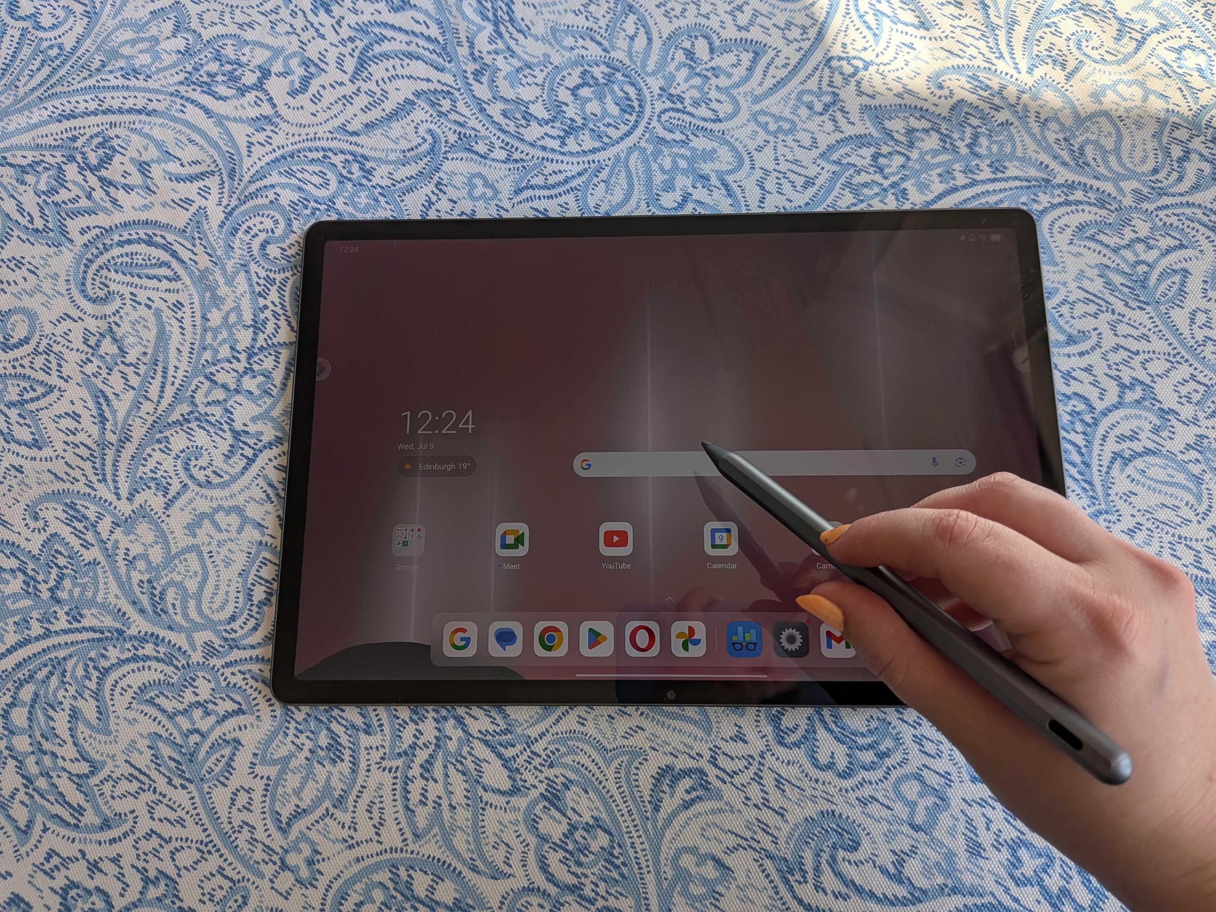 A Lenovo Idea Tab Pro tablet on a blue and white table