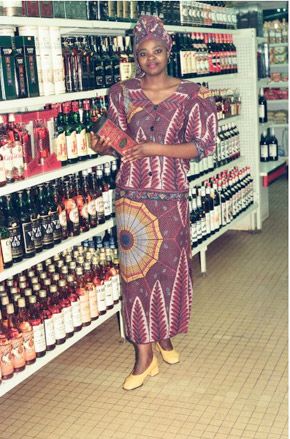 African woman wearing traditional clothes in supermarket