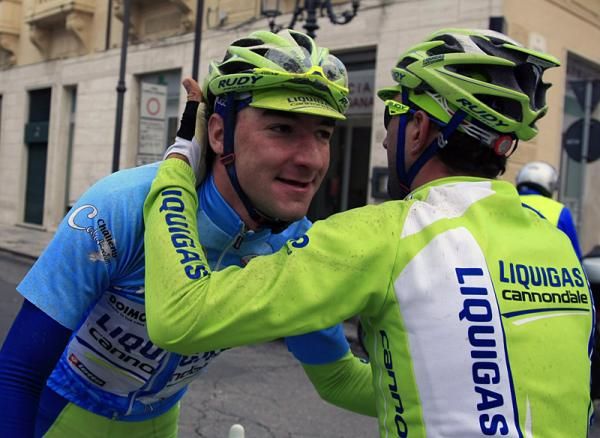 Stage 2 victor and overall winner Elia Viviani is congratulated by a Liquigas-Cannondale teammate.