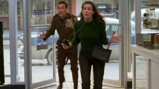 Ethan Embry and Liv Tyler enter the electronics showroom screaming in delight in That Thing You Do!