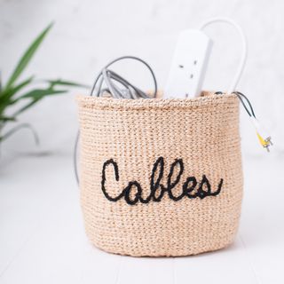 woven embroidered basket with cables charger extension leads