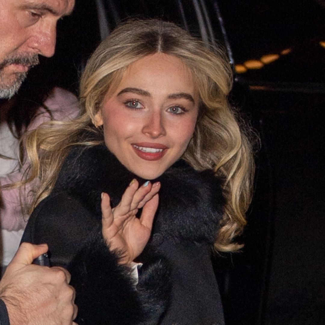  Sabrina Carpenter is seen on January 17, 2026 in New York City wearing a black fur-trimmed coat, a silky slip dress, and platform Christian Louboutin heels