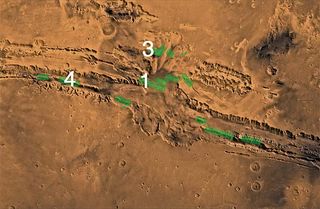 Mars' Valles Marineris canyons, where huge fault lines of rock (green) may have once been seeping with groundwater.