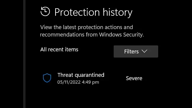 Windows Security protection history showing a "Threat quarantined" entry marked as severe.