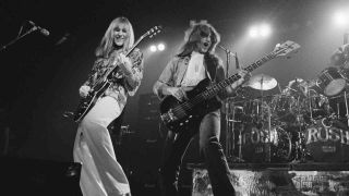 Rush performing onstage in the 1970s