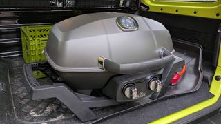 The Napoleon PRO285 grill inside a car trunk