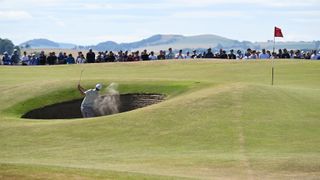 Nicolai Hojgaard of Denmark plays a bunker shot on the 11th hole during Day Three of The 150th Open at St Andrews Old Course