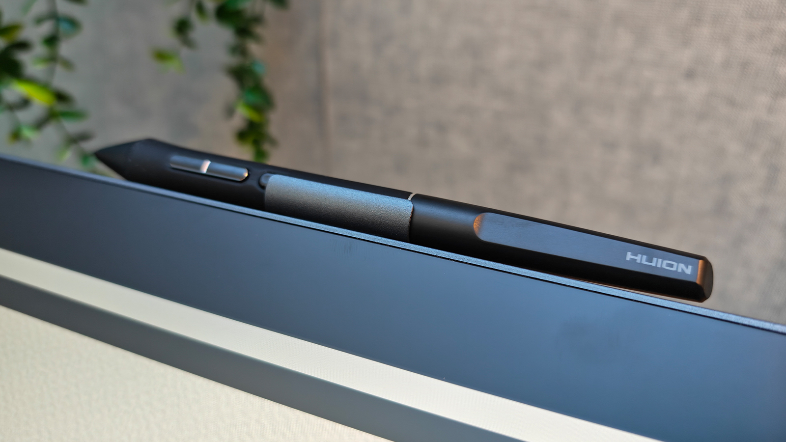 A black drawing tablet on a desk