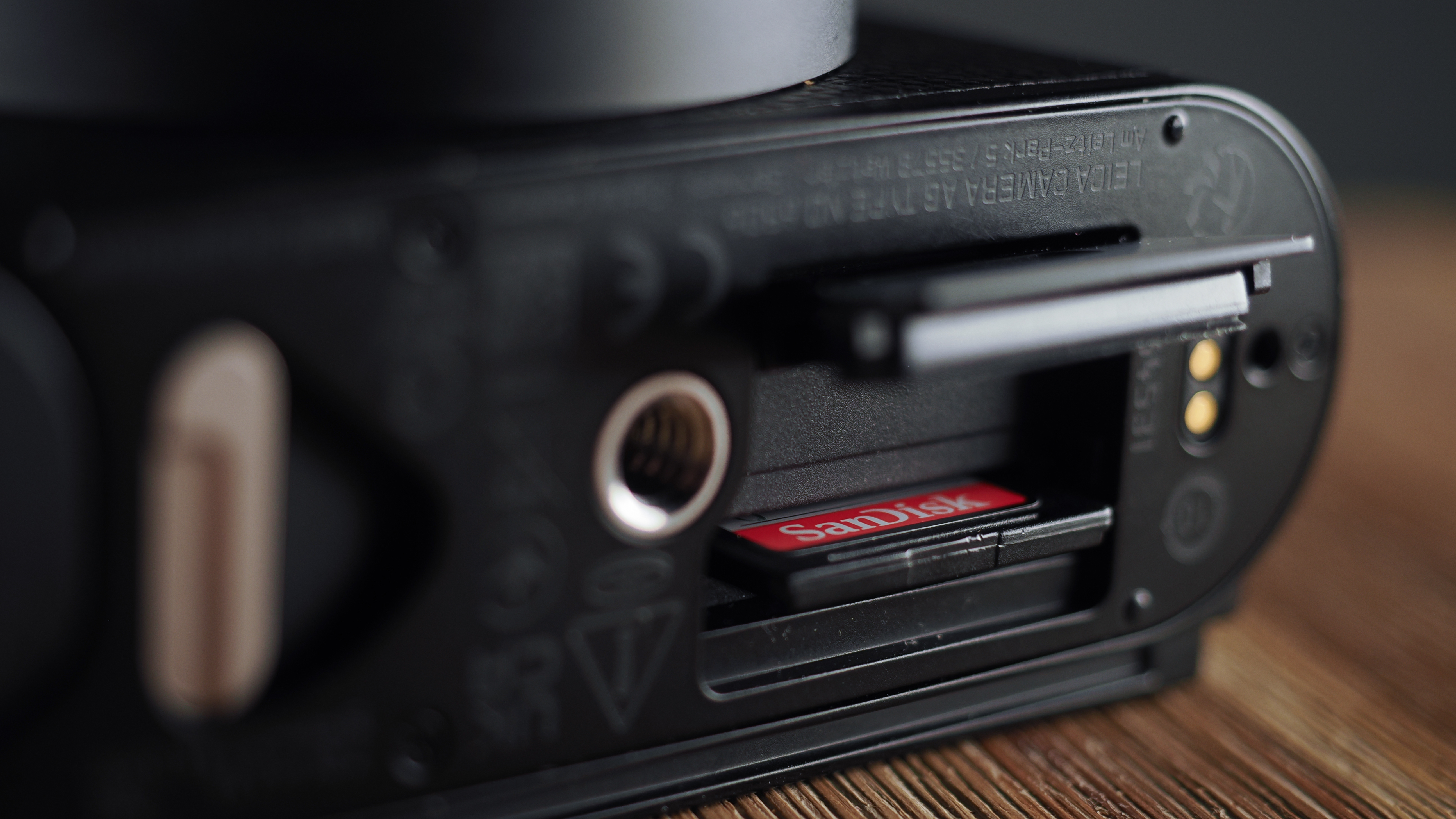 Leica Q3 Monochrom on a wooden surface