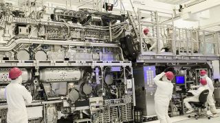 Intel engineers inspect a lithography machine