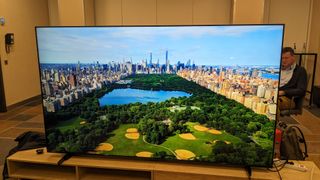 TCL 98P745 with landscape image on screen