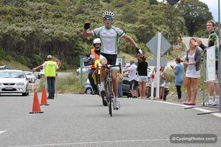 George Bennett (Tasman Glass) finishes the stage, 21 seconds ahead of Hayden Roulston