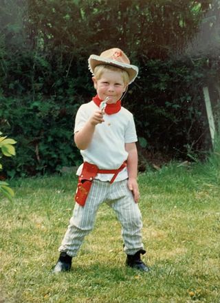 Young Josh Widdicombe wearing cowboy outfit