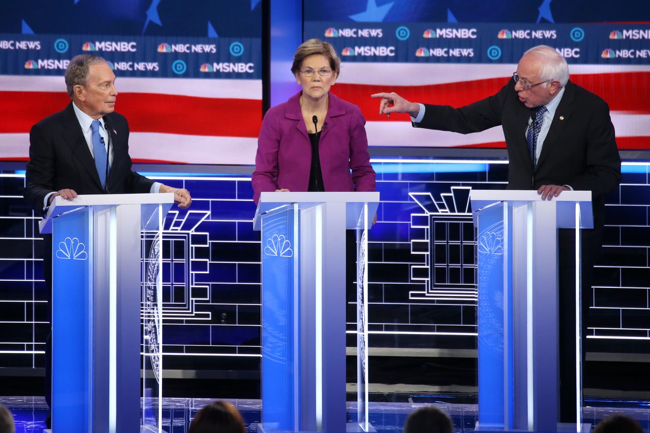 LAS VEGAS, NEVADA - FEBRUARY 19: Democratic presidential candidate Sen. Bernie Sanders (I-VT) (R) gestures as Sen. Elizabeth Warren (D-MA) and former New York City mayor Mike Bloomberg listen