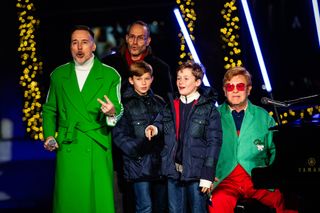 David Furnish and Sir Elton John at the opening ceremony for Saks Fifth Avenue's Holiday Windows and Light show on November 22, 2022 in New York City.